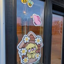 Hand-painted seasonal window art by Banner Barn