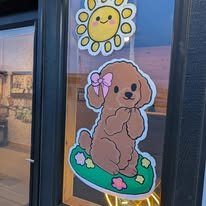 Hand-painted seasonal window art by Banner Barn