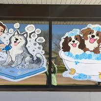Hand-painted seasonal window art by Banner Barn