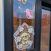Hand-painted seasonal window art by Banner Barn