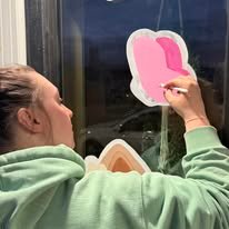 Hand-painted seasonal window art by Banner Barn